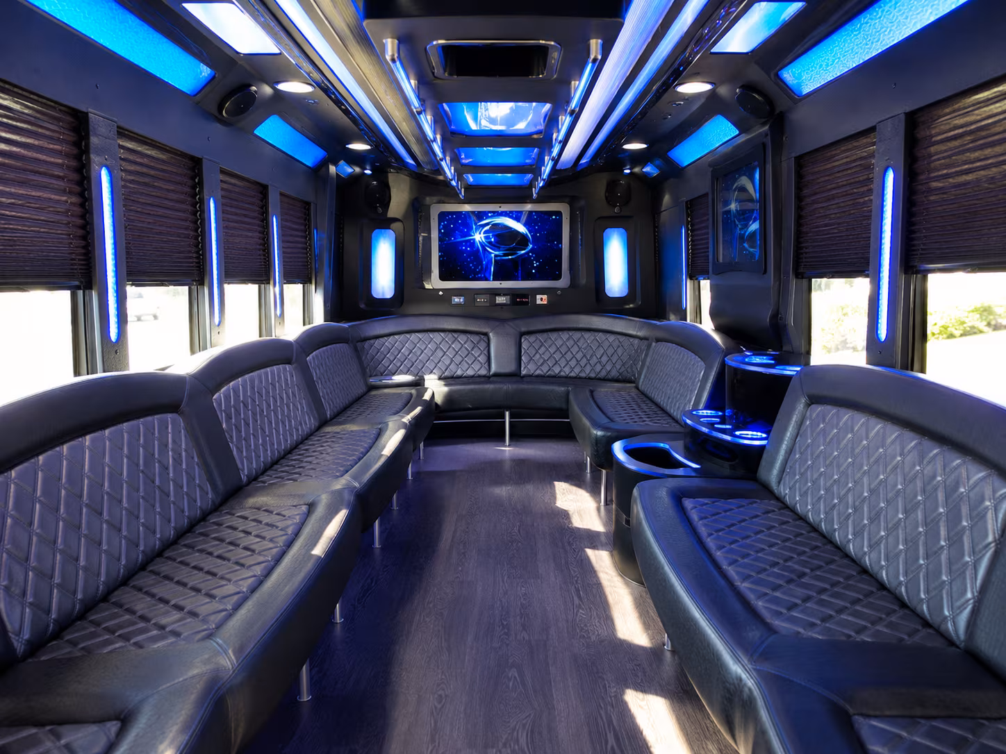 Group beside a Mercedes Sprinter limo in Grand Rapids