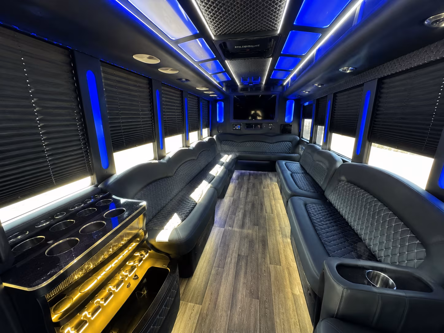Wedding guests seated inside a party bus serving Grand Rapids