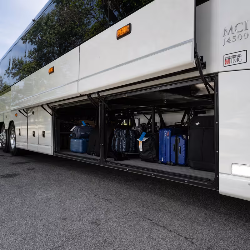 Party bus interior with wraparound leather seating and LED lighting in Grand Rapids