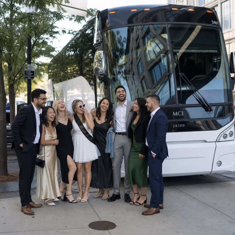 Passengers loading luggage while boarding an Grand Rapids group shuttle
