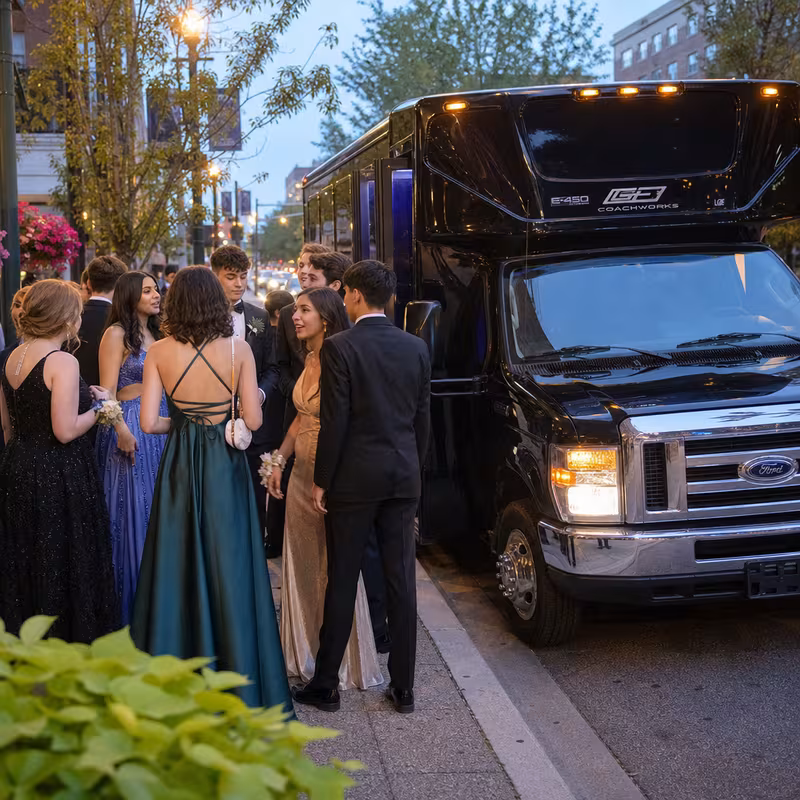 Passengers loading luggage while boarding an Grand Rapids group shuttle