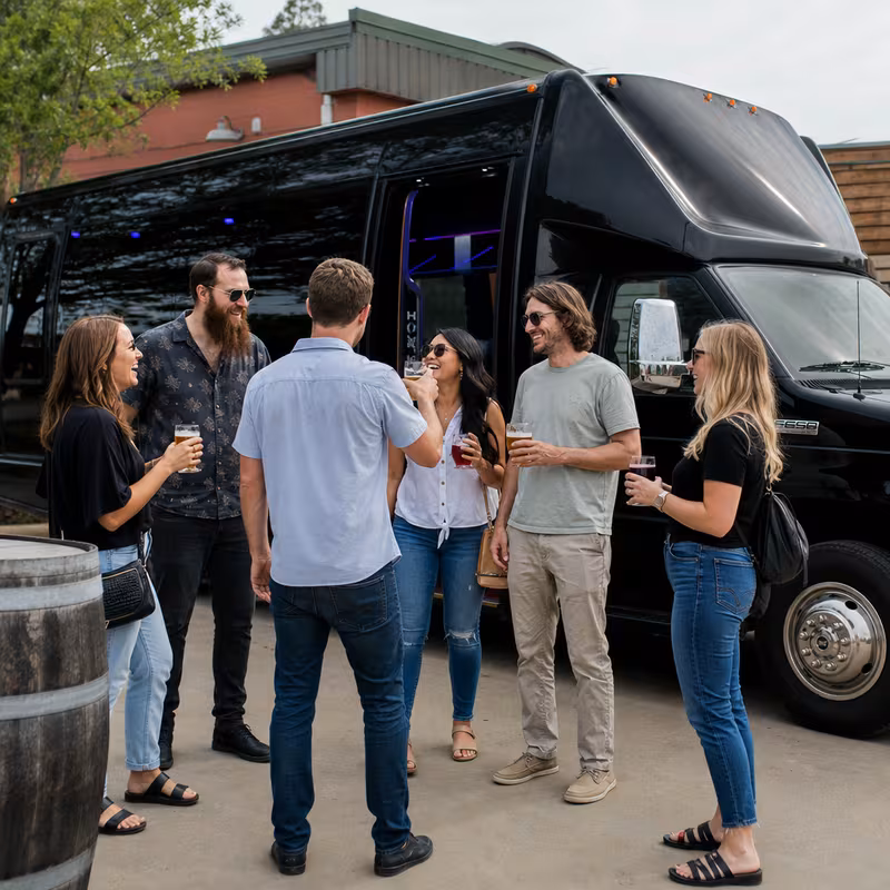 Passengers loading luggage while boarding an Grand Rapids group shuttle
